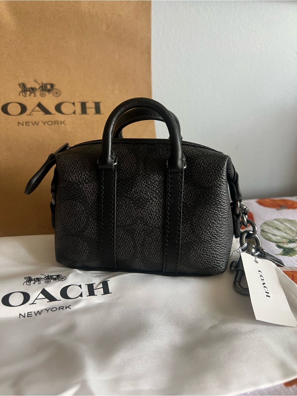 Coach Mini Trekker bag charm in Black & Gunmetal Hardware